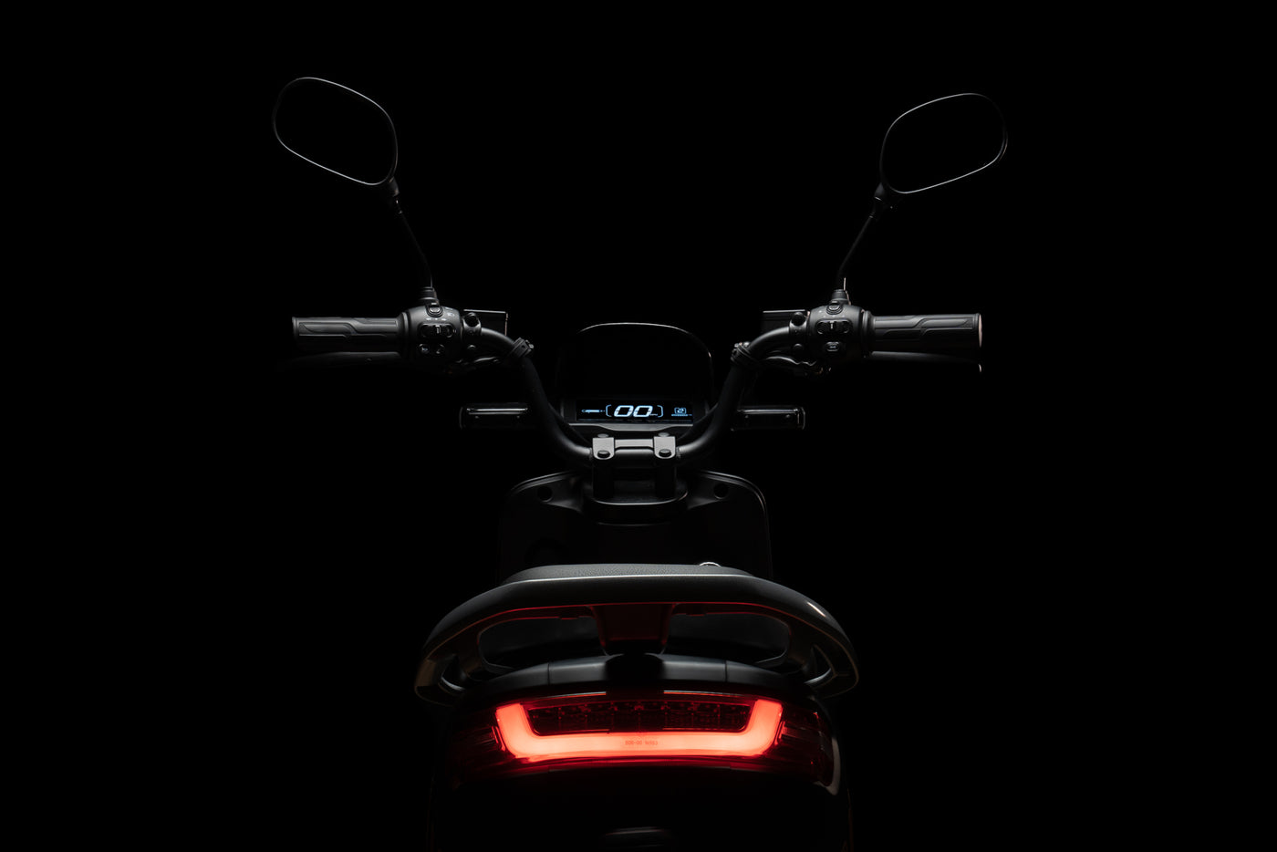 Black Bilis Electric Moped on black background with red LED lights
